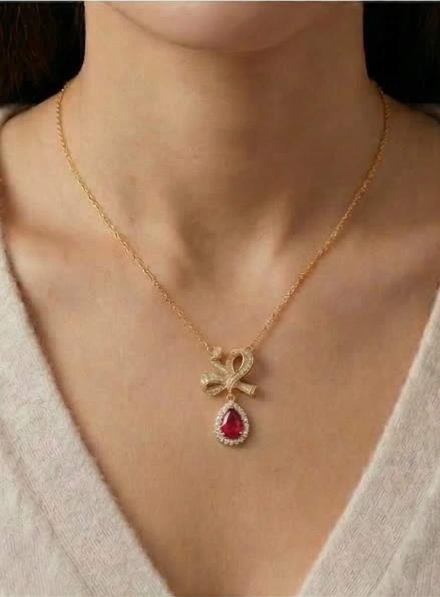 925 Sterling Silver Ribbon Bow Pendant Necklace Jewellery with Red Stone in Gold Plated Finish