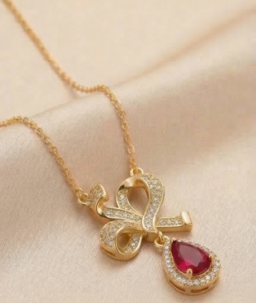 925 Sterling Silver Ribbon Bow Pendant Necklace Jewellery with Red Stone in Gold Plated Finish